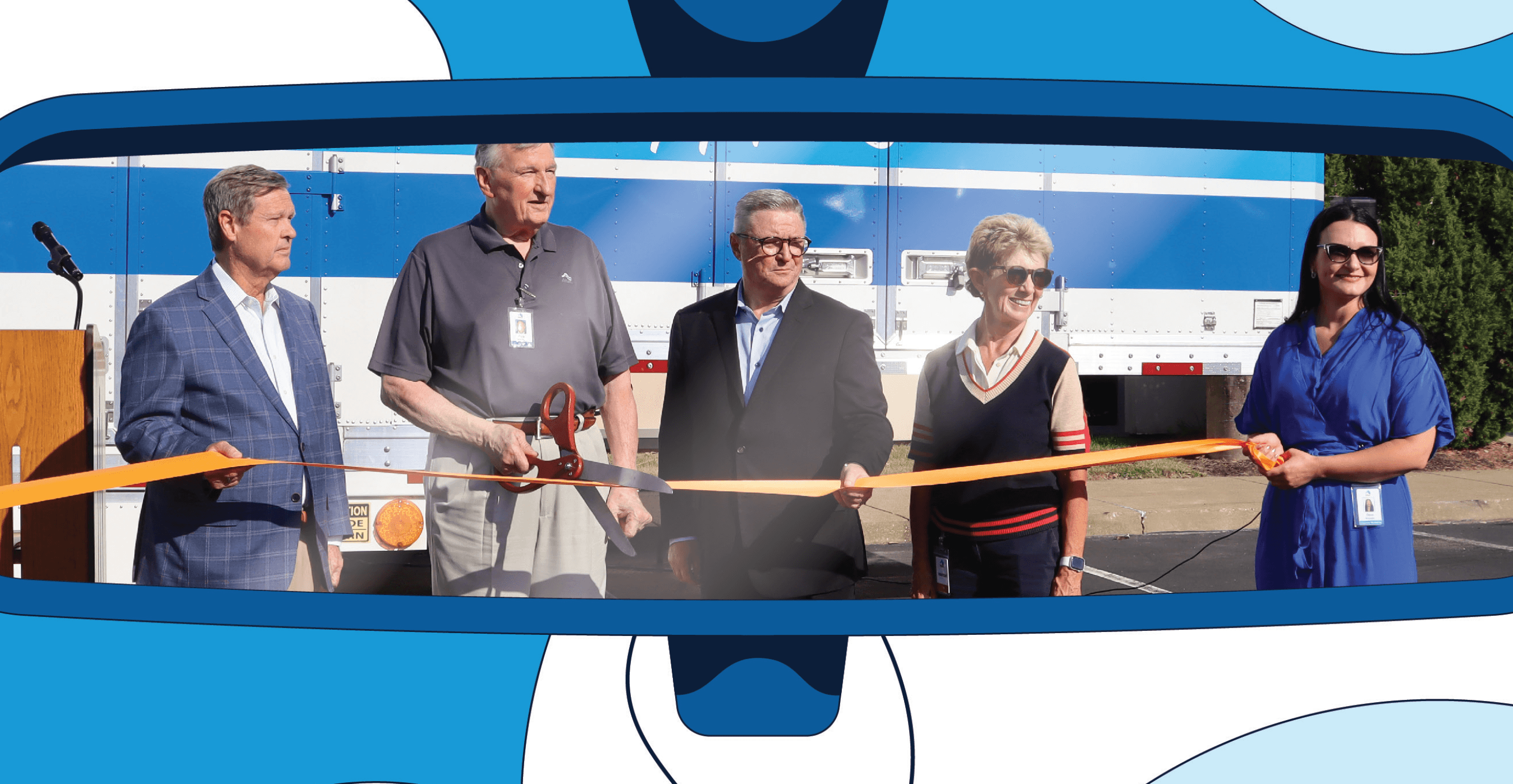 Atlas team cutting opening ribbon